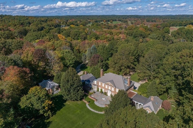 birds eye view of property with a forest view