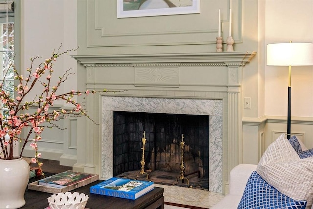 room details with a decorative wall and a fireplace