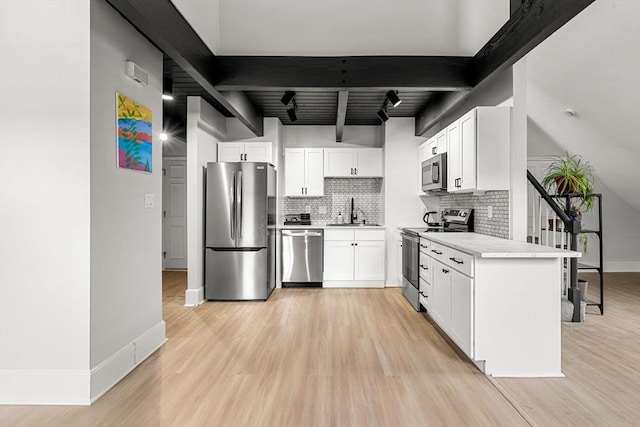 256 Lafayette St Unit 3, Salem, MA 01970 - kitchen with appliances with stainless steel finishes, tasteful backsplash, light wood-type flooring, and light countertops