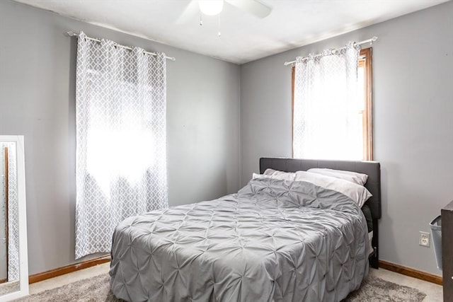bedroom with carpet floors, baseboards, and a ceiling fan