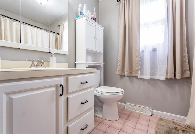 full bathroom featuring tile patterned flooring, baseboards, vanity, and toilet