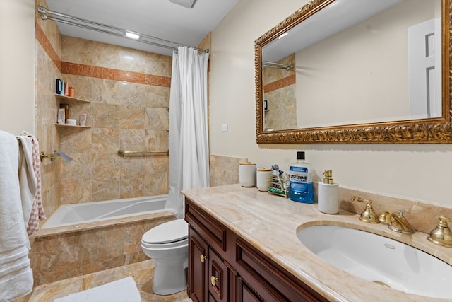 full bathroom featuring shower / bath combo with shower curtain, vanity, and toilet