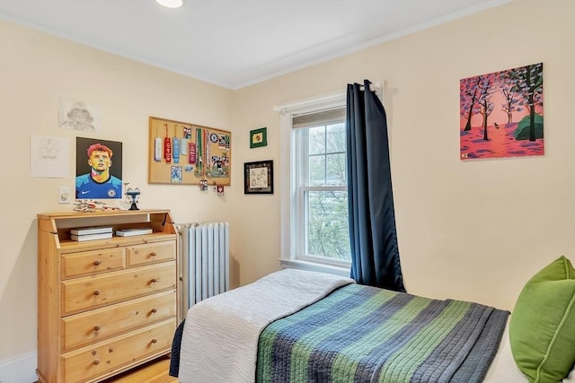 bedroom with radiator and ornamental molding
