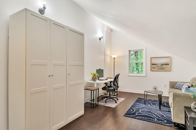 office area with lofted ceiling, dark wood finished floors, and baseboards