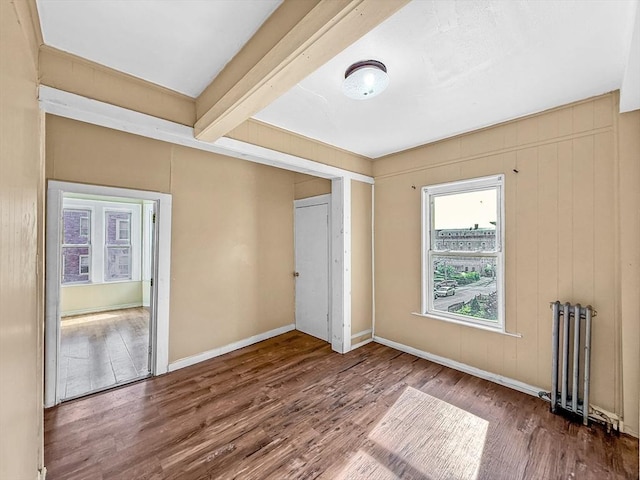 19 High St, Lynn, MA 01902 - spare room with wood finished floors and beamed ceiling