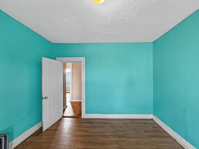 19 High St, Lynn, MA 01902 - spare room with wood finished floors and a textured ceiling