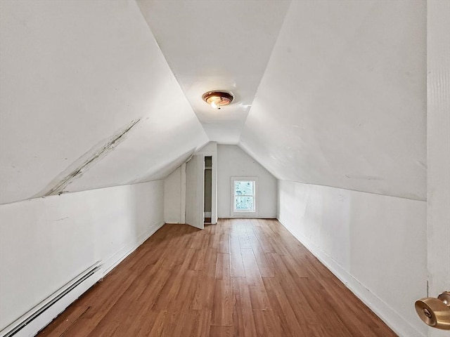 19 High St, Lynn, MA 01902 - additional living space featuring baseboard heating, wood finished floors, and vaulted ceiling