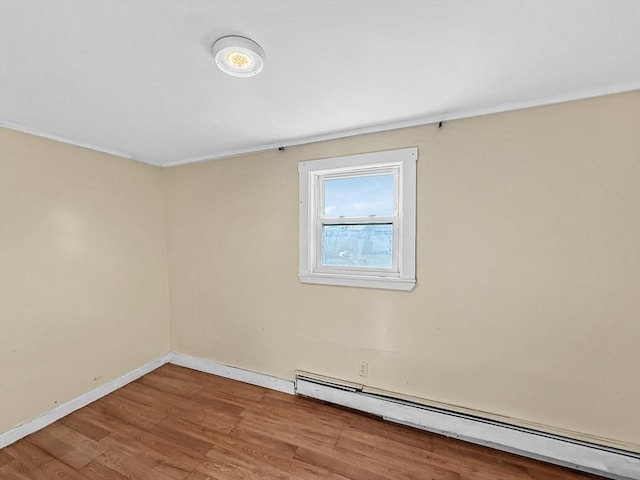 19 High St, Lynn, MA 01902 - empty room with a baseboard radiator, wood finished floors, and crown molding
