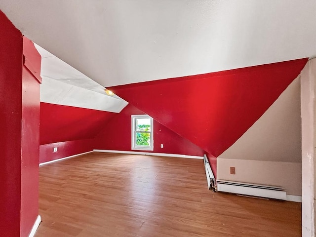 19 High St, Lynn, MA 01902 - bonus room featuring wood finished floors, lofted ceiling, and a baseboard heating unit