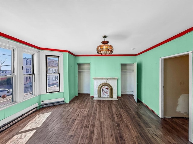 19 High St, Lynn, MA 01902 - unfurnished living room featuring wood finished floors, a fireplace with flush hearth, crown molding, and a baseboard radiator
