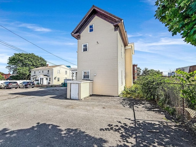 19 High St, Lynn, MA 01902 - rear view of house featuring uncovered parking