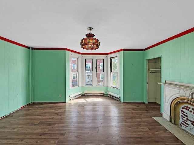 19 High St, Lynn, MA 01902 - unfurnished living room with wood-type flooring, crown molding, baseboard heating, and a fireplace with flush hearth