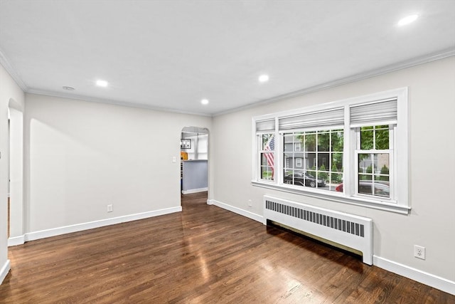 181 Manchester St, Boston, MA 02126 - empty room featuring radiator, crown molding, arched walkways, wood finished floors, and recessed lighting