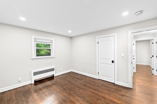 181 Manchester St, Boston, MA 02126 - unfurnished bedroom featuring radiator, dark wood-type flooring, and recessed lighting
