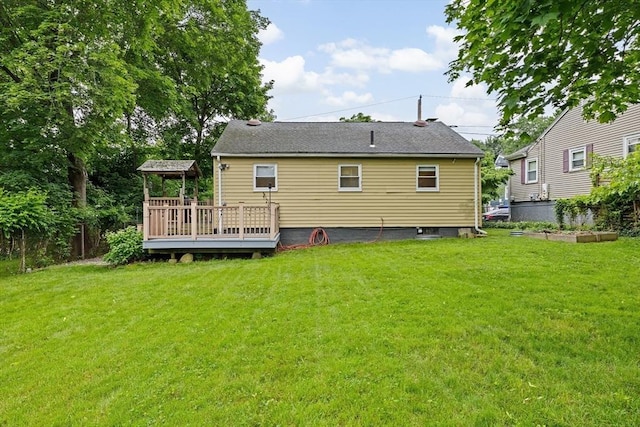 181 Manchester St, Boston, MA 02126 - rear view of property with a deck and a lawn
