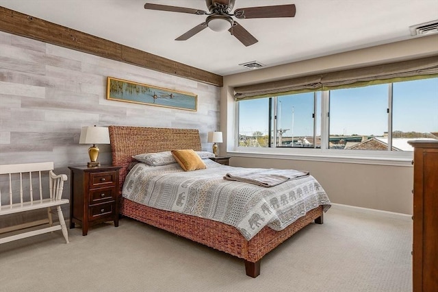 carpeted bedroom with baseboards, ceiling fan, and visible vents