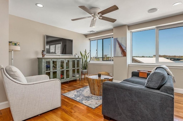sitting room featuring recessed lighting, a ceiling fan, wood finished floors, and visible vents