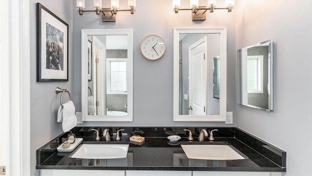 60 Wright St, Arlington, MA 02474 - bathroom with a chandelier and double vanity