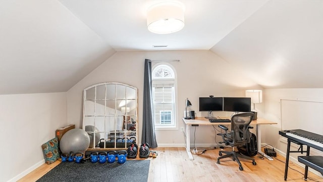 60 Wright St, Arlington, MA 02474 - home office featuring wood finished floors, lofted ceiling, and baseboards