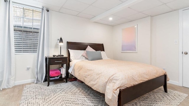 60 Wright St, Arlington, MA 02474 - bedroom with wood finished floors, a drop ceiling, and baseboards