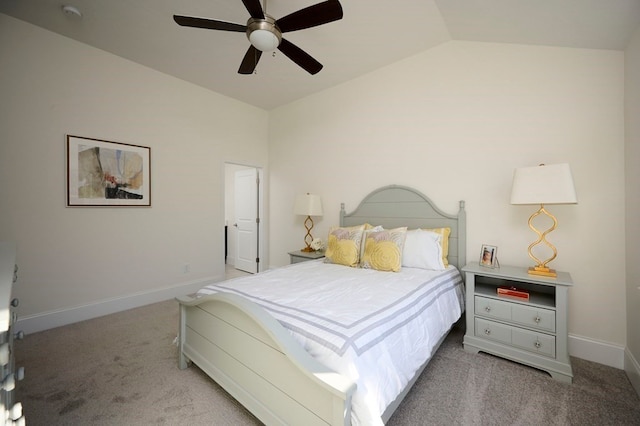 carpeted bedroom with ceiling fan and vaulted ceiling