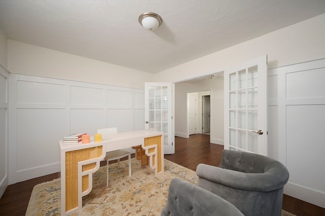 home office with french doors and dark wood-type flooring