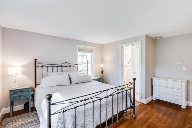 18 Tupelo, Harwich, MA 02645 - bedroom featuring dark wood finished floors, baseboards, and ensuite bath