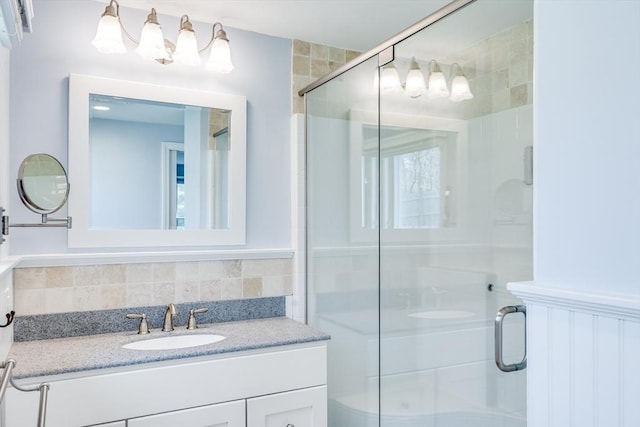 18 Tupelo, Harwich, MA 02645 - bathroom featuring a shower stall, vanity, and backsplash