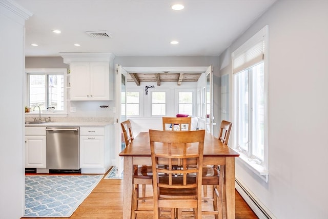 18 Tupelo, Harwich, MA 02645 - dining area featuring light wood finished floors, healthy amount of natural light, recessed lighting, baseboard heating, and beamed ceiling