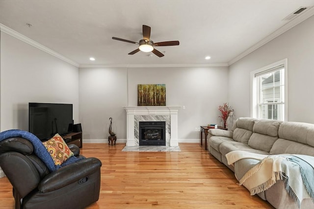 30 Compass Pt Unit 30, North Andover, MA 01845 - living room featuring ceiling fan, light wood finished floors, recessed lighting, crown molding, and a high end fireplace