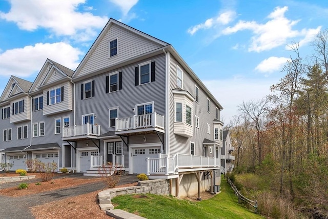 30 Compass Pt Unit 30, North Andover, MA 01845 - view of front of house with an attached garage, driveway, and a balcony