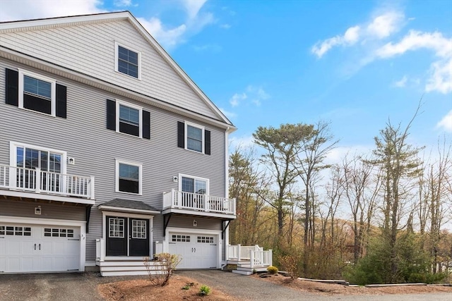 30 Compass Pt Unit 30, North Andover, MA 01845 - view of front of house featuring asphalt driveway, a garage, and a balcony