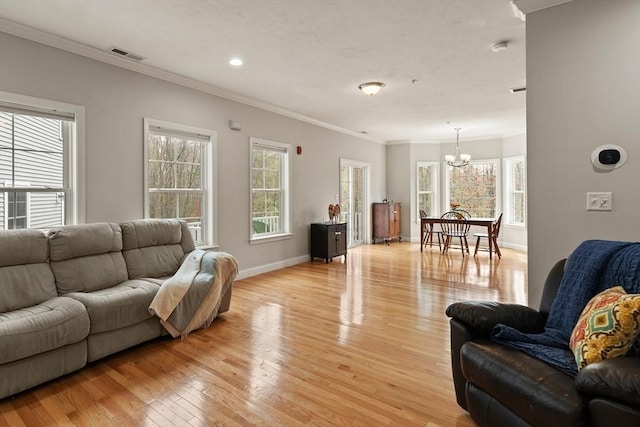30 Compass Pt Unit 30, North Andover, MA 01845 - living room featuring a chandelier, crown molding, light wood finished floors, plenty of natural light, and recessed lighting
