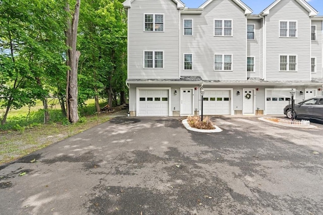 35 Fredonian St Unit K, Shirley, MA 01464 - view of property featuring a garage and driveway
