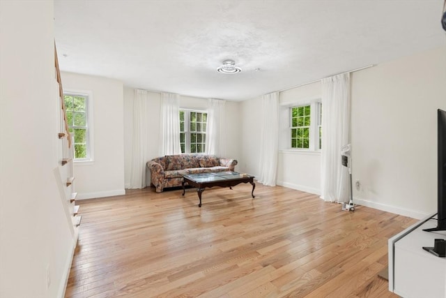 35 Fredonian St Unit K, Shirley, MA 01464 - living area featuring healthy amount of natural light and light wood finished floors