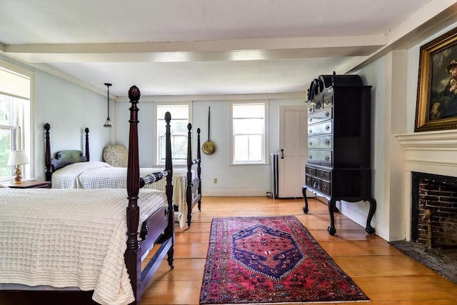 79 Nobscot Rd, Sudbury, MA 01776 - bedroom with a fireplace with flush hearth and light wood-type flooring