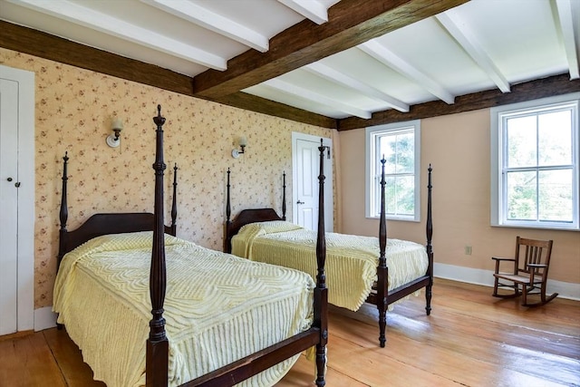 79 Nobscot Rd, Sudbury, MA 01776 - bedroom with light wood-style flooring, beam ceiling, baseboards, and wallpapered walls