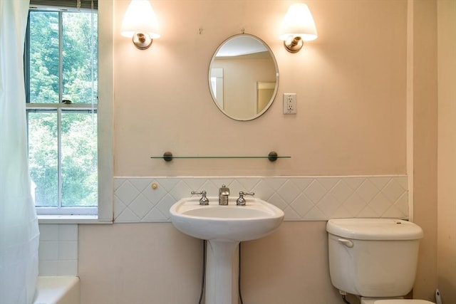 79 Nobscot Rd, Sudbury, MA 01776 - full bathroom with toilet, tile walls, a bath, and a wainscoted wall