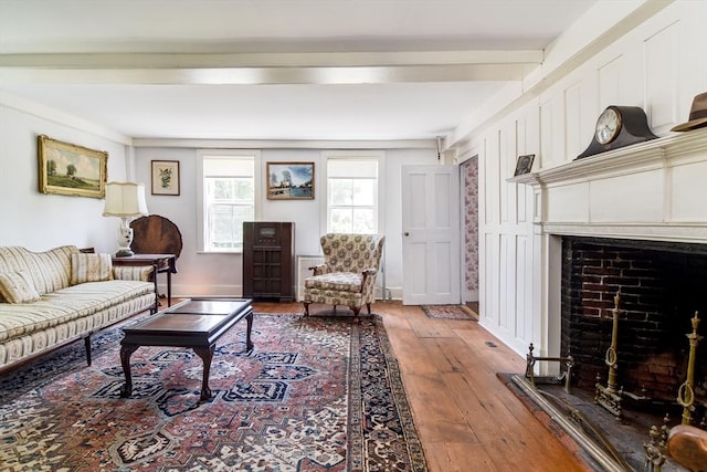 79 Nobscot Rd, Sudbury, MA 01776 - living room with a fireplace, light wood finished floors, and beamed ceiling
