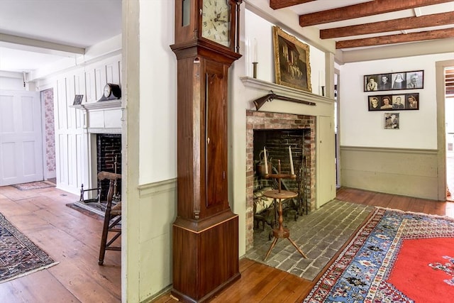 79 Nobscot Rd, Sudbury, MA 01776 - hall with beam ceiling, hardwood / wood-style flooring, and wainscoting