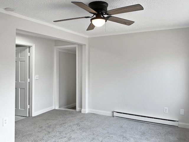 carpeted empty room featuring ceiling fan, a baseboard heating unit, crown molding, and a textured ceiling