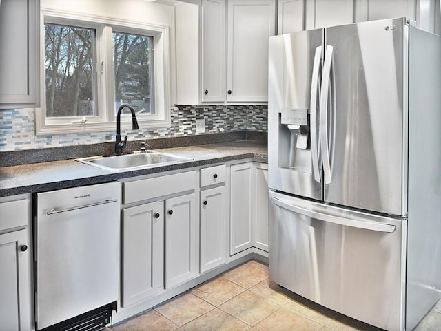 kitchen featuring dishwasher, decorative backsplash, sink, stainless steel fridge with ice dispenser, and light tile patterned floors