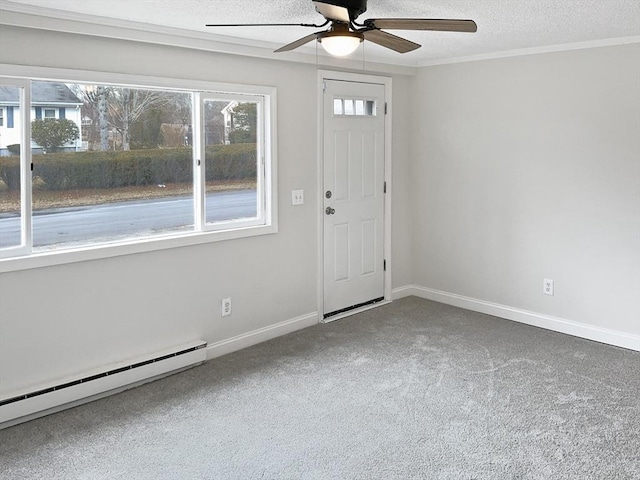 carpeted spare room with ceiling fan, a textured ceiling, and a baseboard radiator