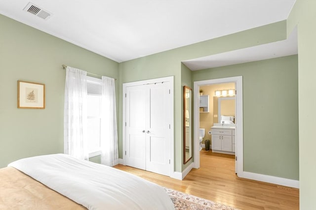 37-39 Lamson St Unit 2, Boston, MA 02128 - bedroom featuring light wood finished floors, baseboards, a closet, and ensuite bath