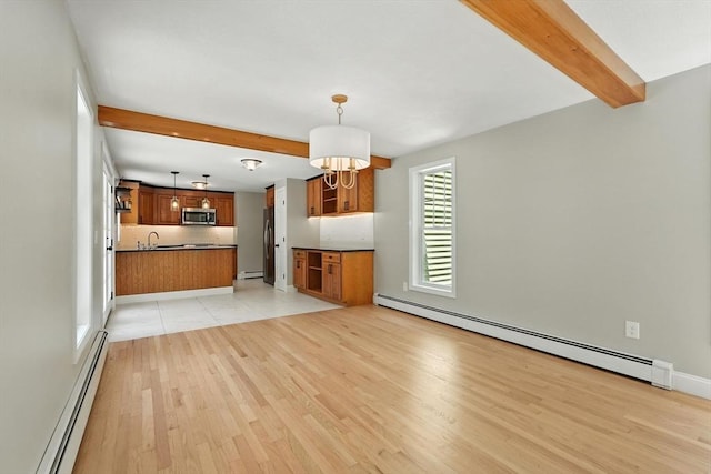147 Mort Vining Rd, Southwick, MA 01077 - unfurnished living room featuring a baseboard radiator, beam ceiling, light wood finished floors, a chandelier, and baseboard heating