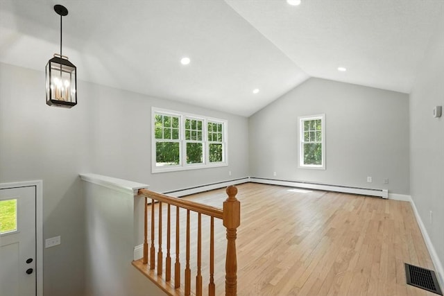 147 Mort Vining Rd, Southwick, MA 01077 - additional living space featuring wood finished floors, healthy amount of natural light, lofted ceiling, recessed lighting, and a baseboard radiator