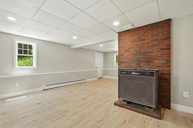147 Mort Vining Rd, Southwick, MA 01077 - unfurnished living room featuring a baseboard radiator, a paneled ceiling, light wood-style flooring, and recessed lighting