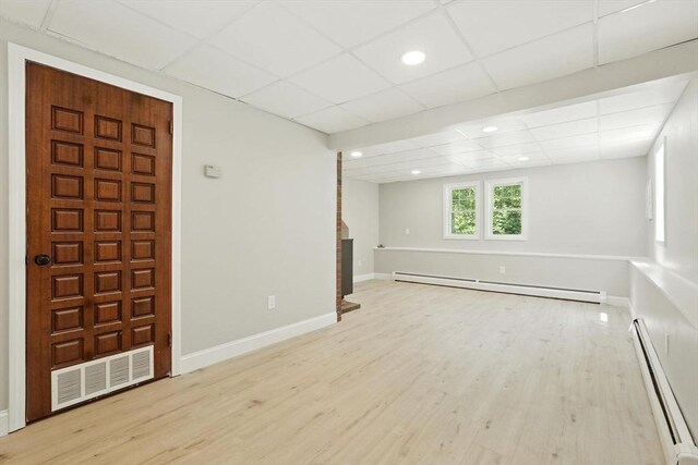 147 Mort Vining Rd, Southwick, MA 01077 - empty room featuring baseboard heating, a paneled ceiling, wood finished floors, a fireplace, and recessed lighting
