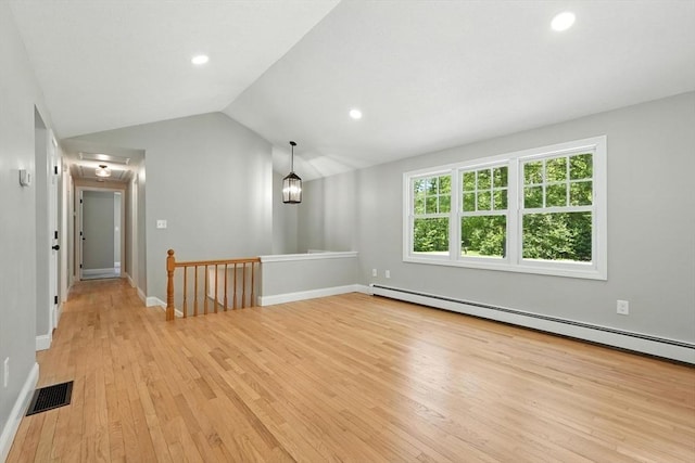 147 Mort Vining Rd, Southwick, MA 01077 - empty room with baseboard heating, light wood finished floors, recessed lighting, and vaulted ceiling