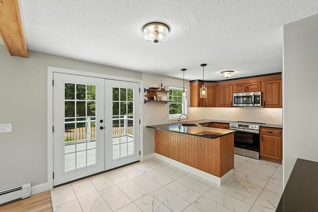 147 Mort Vining Rd, Southwick, MA 01077 - kitchen with stainless steel appliances, french doors, baseboard heating, a peninsula, and light marble finish floors